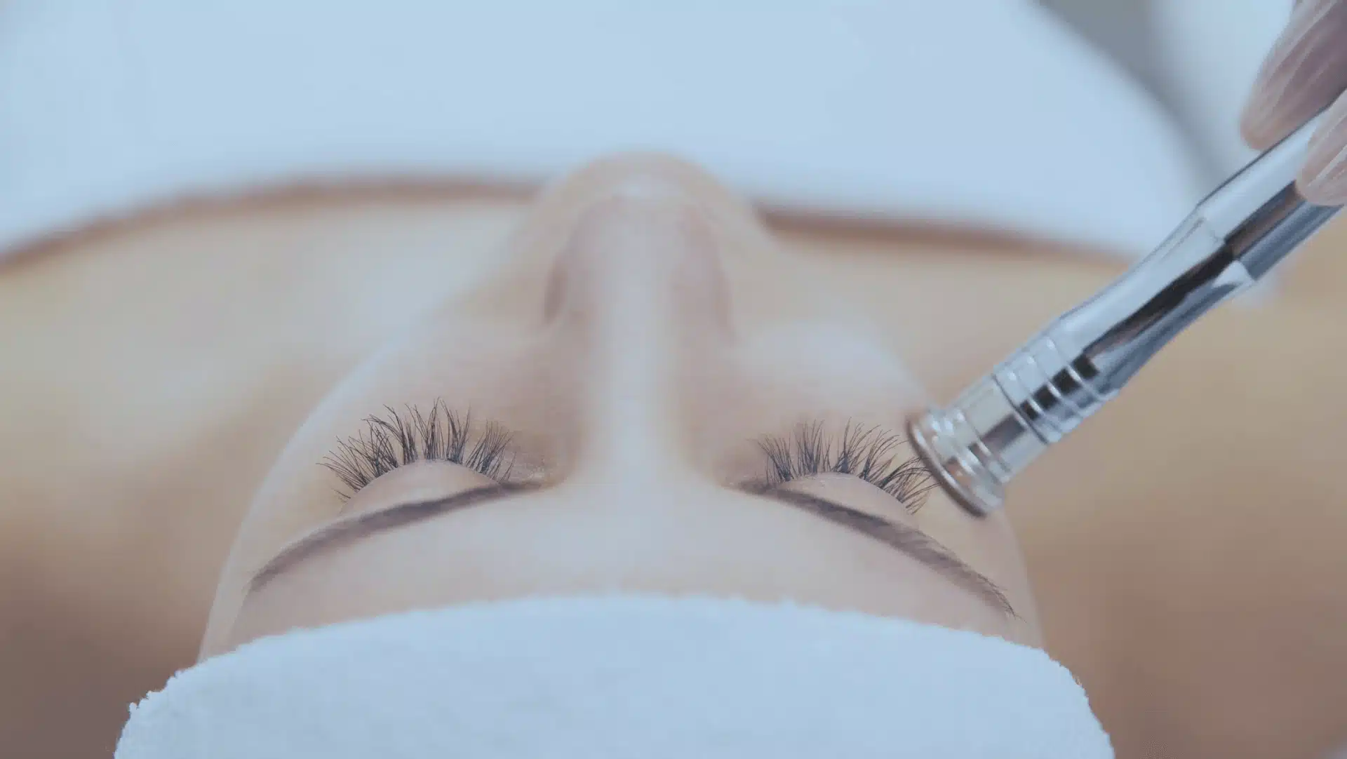 A close-up of a patient receiving a dermatological facial treatment
